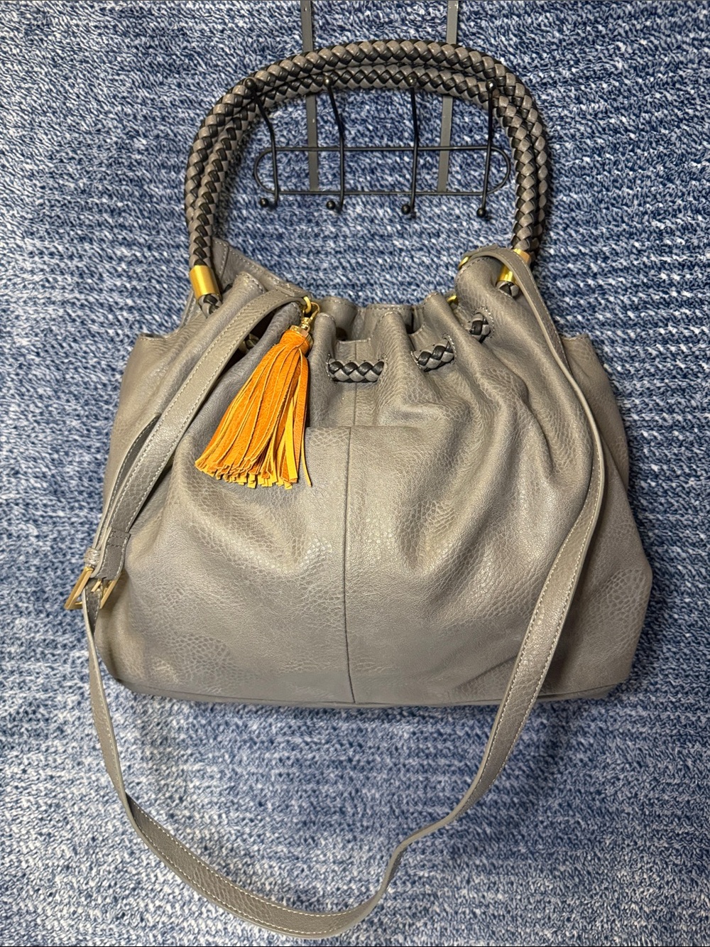 Gray Leather Drawstring Shoulder Bag with Yellow Tassel Accent